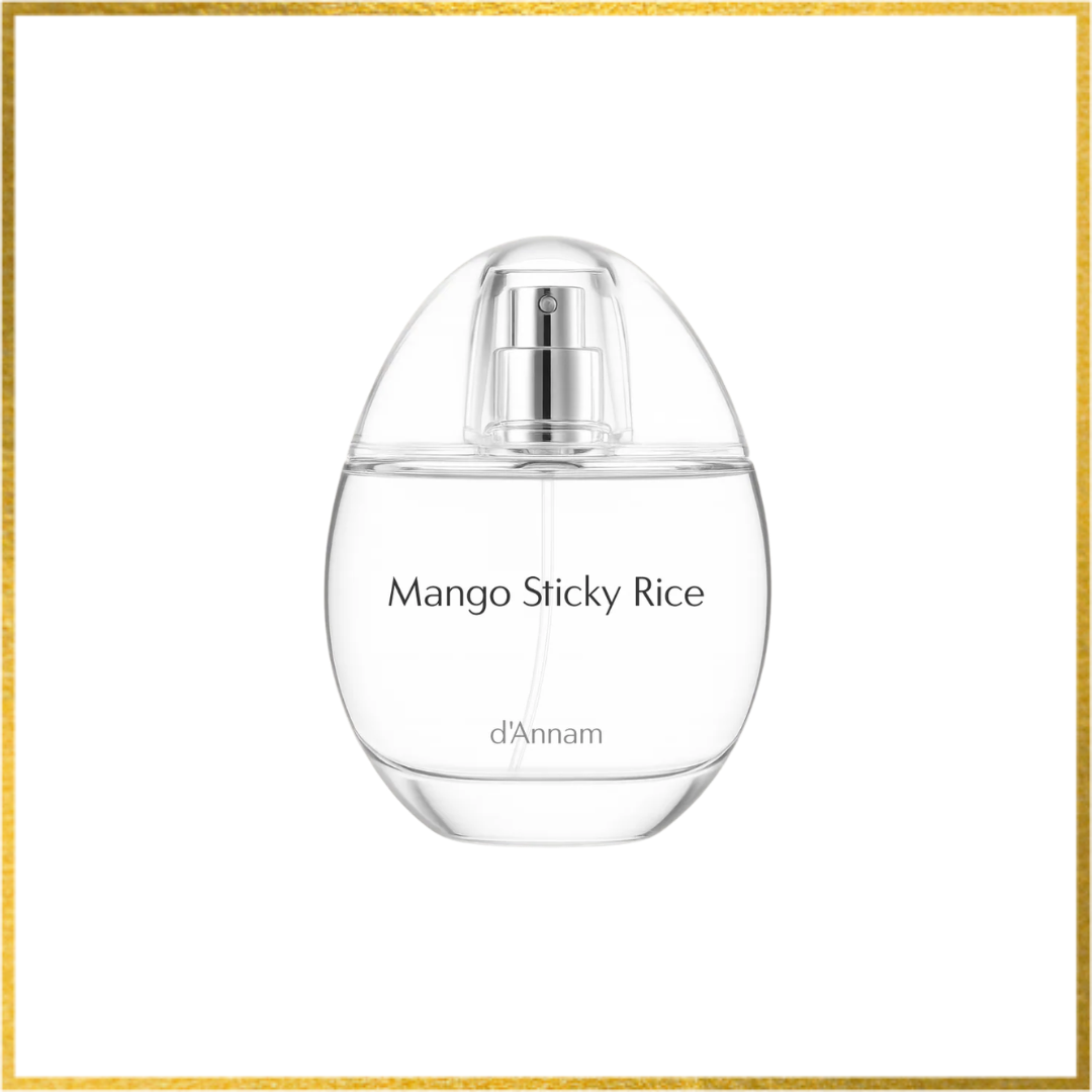 Perfume bottle labeled 'Mango Sticky Rice' by d'Annam on a white background