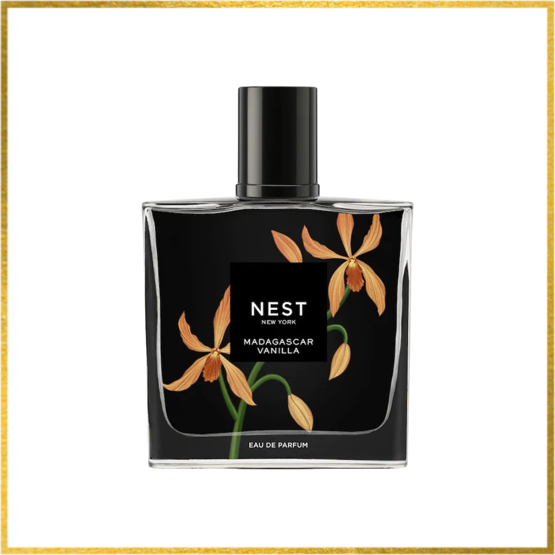 Perfume bottle with floral design on a black background