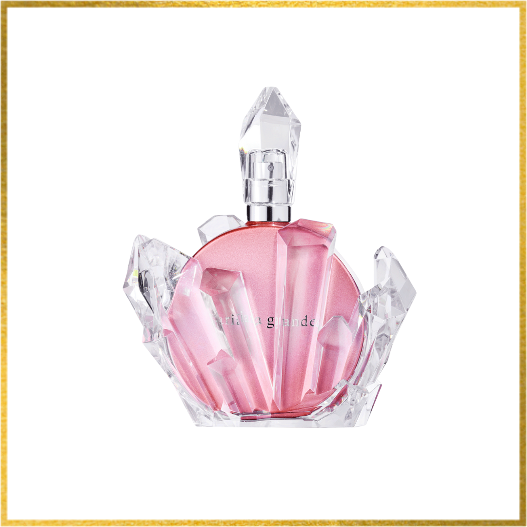 Pink perfume bottle with a crystal design on a white background. Ariana grande r.e.m. cherry eclipse