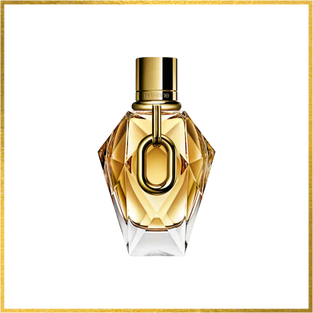 Gold perfume bottle with a clear base on a white background