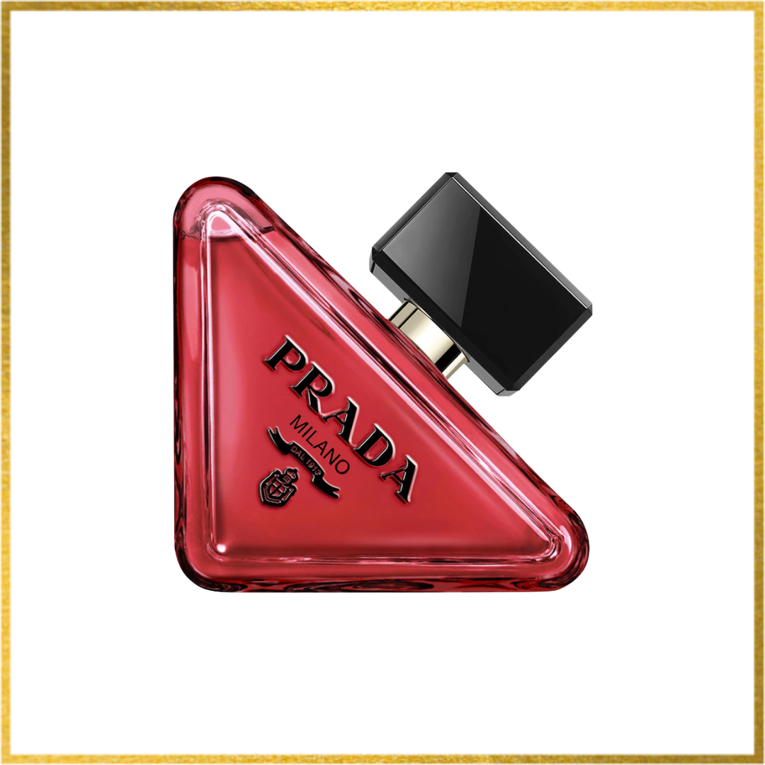 Red triangular Prada Paradoxe Radical Essence perfume bottle on a white background