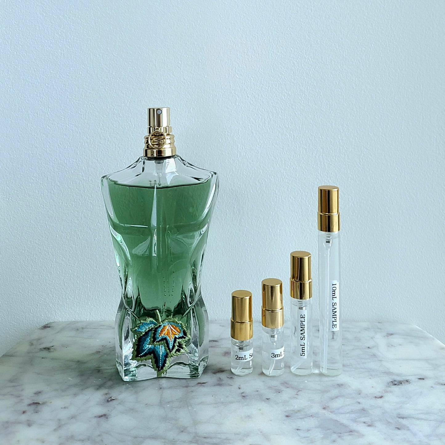 Jean Paul Gaultier Le Beau Paradise Garden and sample vials in 2mL, 3mL, 5mL, and 10mL sizes