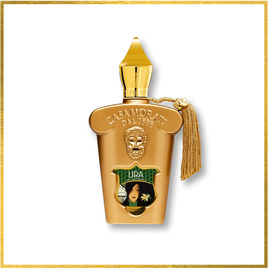 A gold-colored bottle of Xerjoff Lira gourmand fragrance with a decorative tassel and a portrait of a woman on the label.